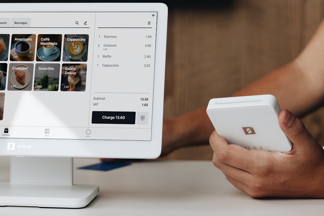 A SumUp card reader and a POS system are shown together in a café environment, offering easy-to-use payment solutions for small businesses.